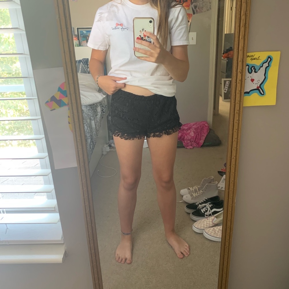 Black lace “Almost Famous” shorts